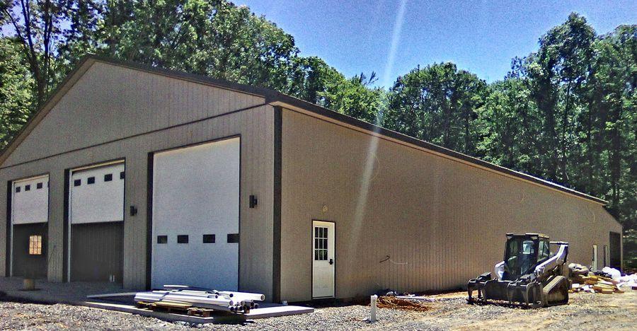Multi-bay pole barn with overhead doors