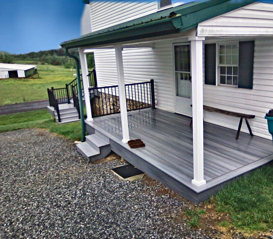Gray composite deck boards on a covered front porch