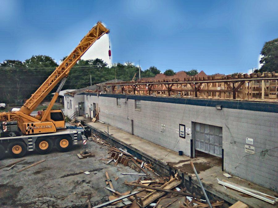 Crane work on a commercial roof replacement